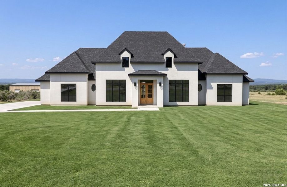 Front exterior of a new home in , Bandera, TX, highlighting curb appeal (Image 1). Front exterior of a new home in , Bandera, TX, highlighting curb appeal (Image 1).