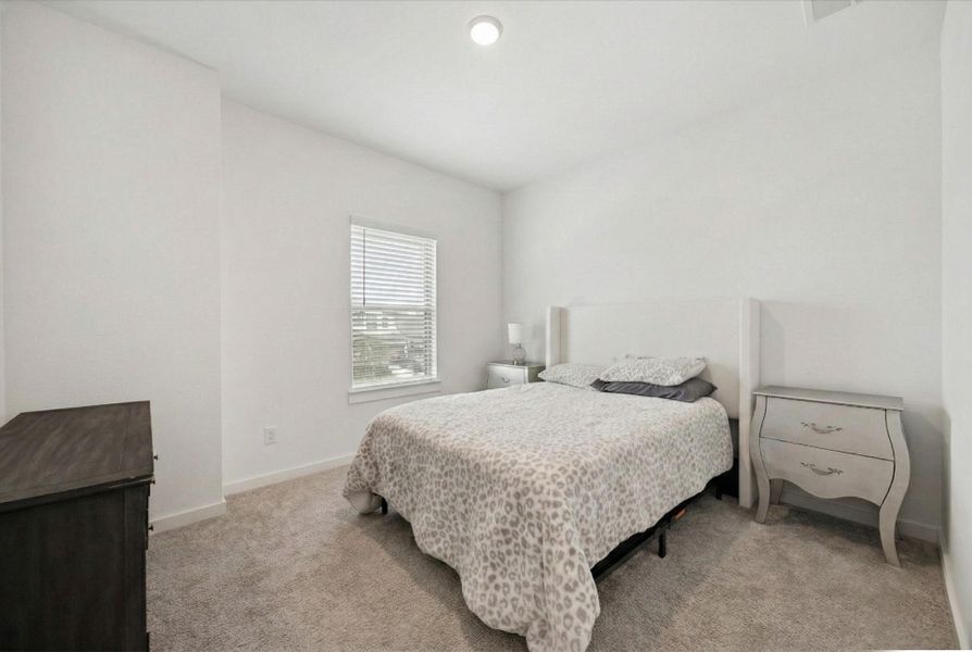 BEDROOM 3 OFFERS ENOUGH SPACE FOR A FULL-SIZED BED AND DRESSER.