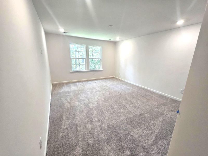 Spacious, unfurnished interior of a new home in Creekside at Andrews, Summerville (Image 13).