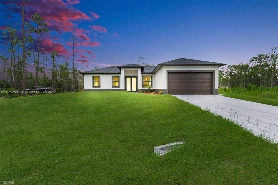 Front exterior of a new home in , Lehigh Acres, FL, highlighting curb appeal (Image 1).