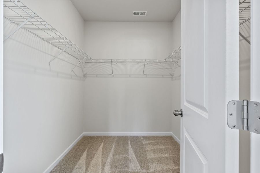 A shower with a tile floor.