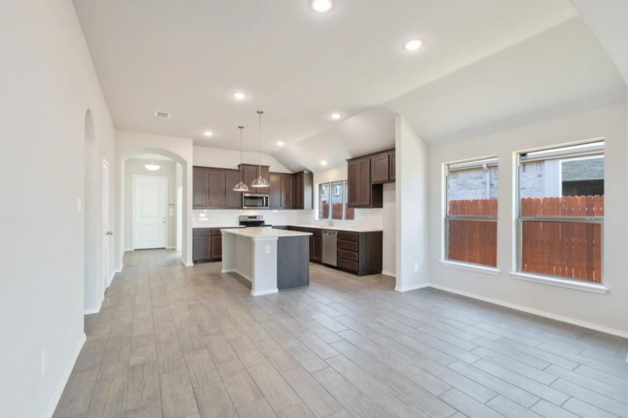 Family Room to Kitchen | Concept 1958 at Redden Farms - Classic Series in Midlothian, TX by Landsea Homes