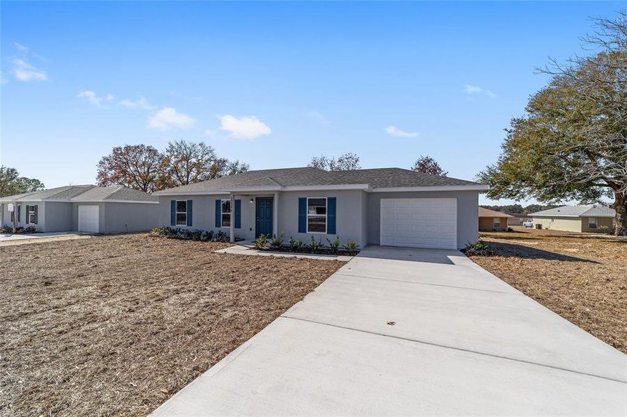 Front exterior of a new home in , Belleview, FL, highlighting curb appeal (Image 19).