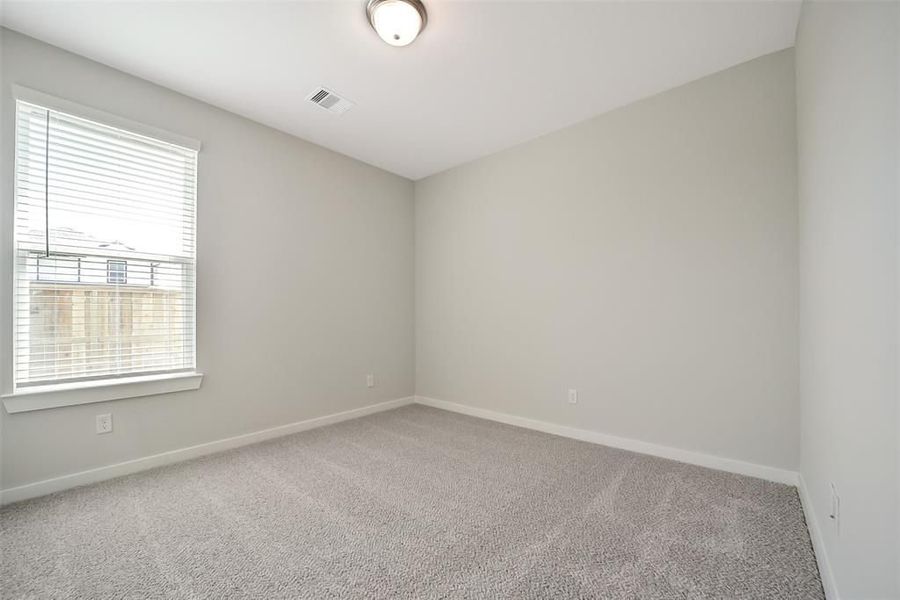 Spacious, unfurnished interior of a new home in Sunterra, Katy (Image 41).