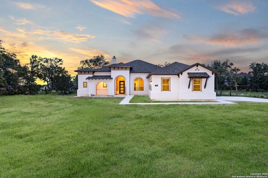 Front exterior of a new home in Potranco Acres, Castroville, TX, highlighting curb appeal (Image 22). Front exterior of a new home in Potranco Acres, Castroville, TX, highlighting curb appeal (Image 22).