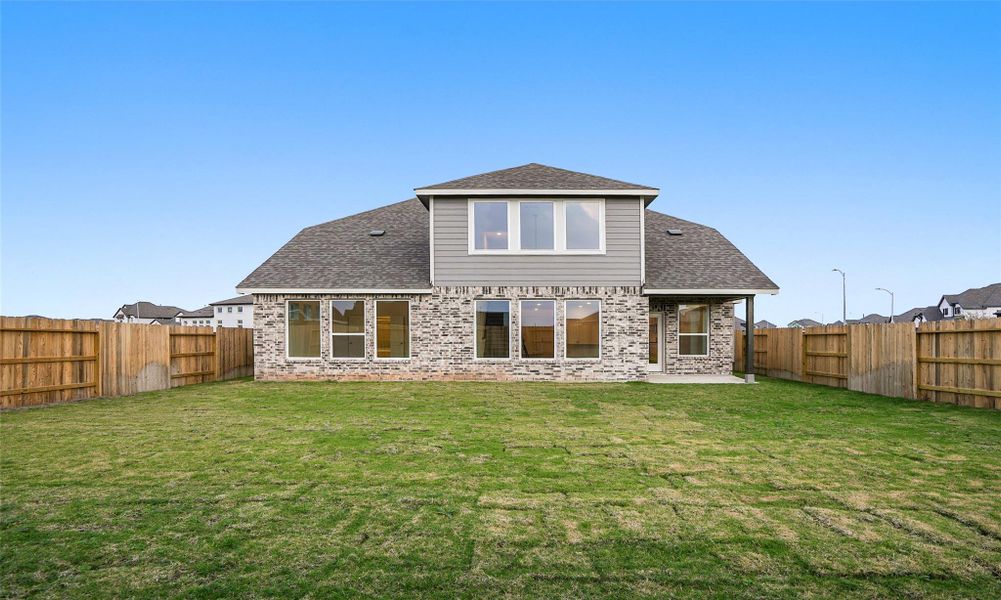 Exterior details and patio area of a home in Brookewater, Rosenberg (Image 19).