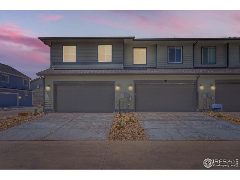 Front exterior of a new home in Waterfield, Fort Collins, CO, highlighting curb appeal (Image 1). Front exterior of a new home in Waterfield, Fort Collins, CO, highlighting curb appeal (Image 1).