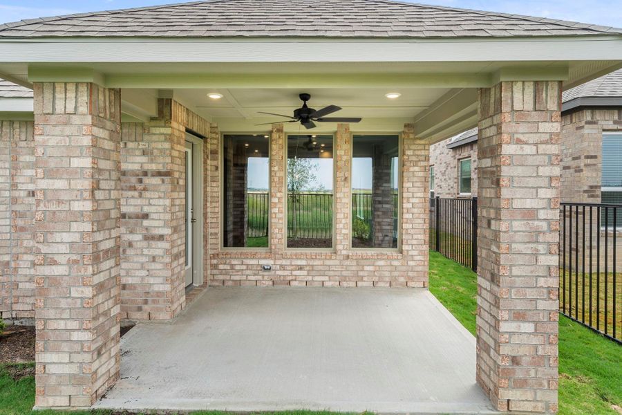 Exterior details and patio area of a home in Bridgeland, Cypress (Image 4).