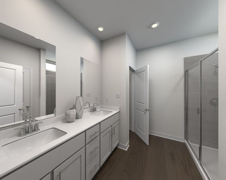 The primary bathroom offers dual vanity sinks and a walk-in closet. The primary bathroom offers dual vanity sinks and a walk-in closet.