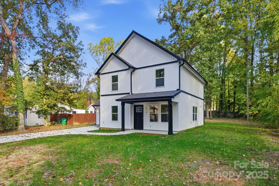 Front exterior of a new home in , Charlotte, NC, highlighting curb appeal (Image 16).
