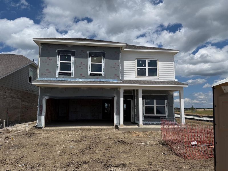 Front exterior of a new home in River Ranch, Dayton, TX, highlighting curb appeal (Image 1).