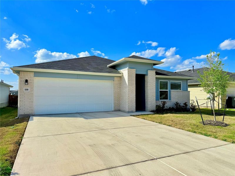 View of front of home featuring brick siding, driveway, a front lawn, and an attached garage View of front of home featuring brick siding, driveway, a front lawn, and an attached garage