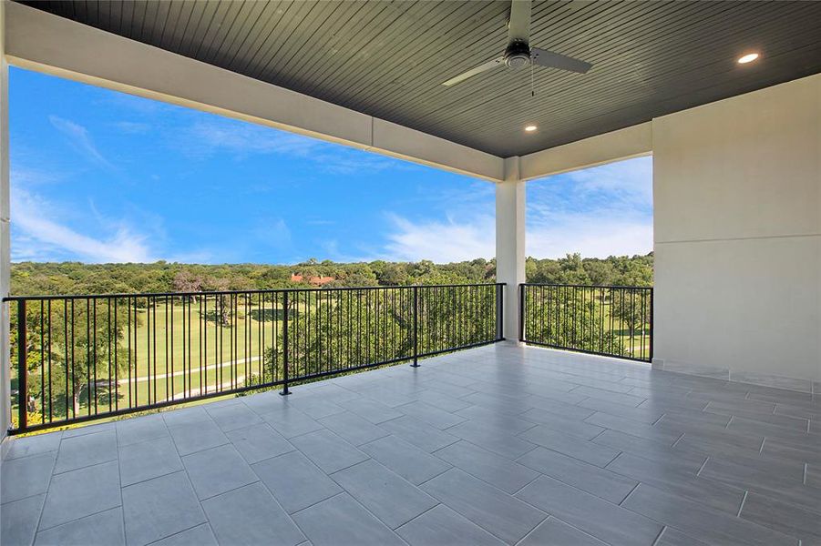 View of patio featuring a balcony and ceiling fan