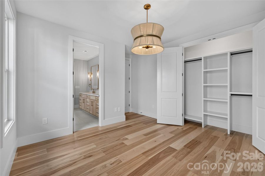Bed 5 with built in shelving and tons of natural light found throughout the entire home.