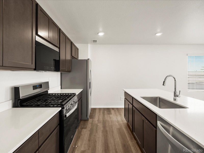 Furnished interior view inside a new home in Skyview at High Point, Aurora (Image 9).
