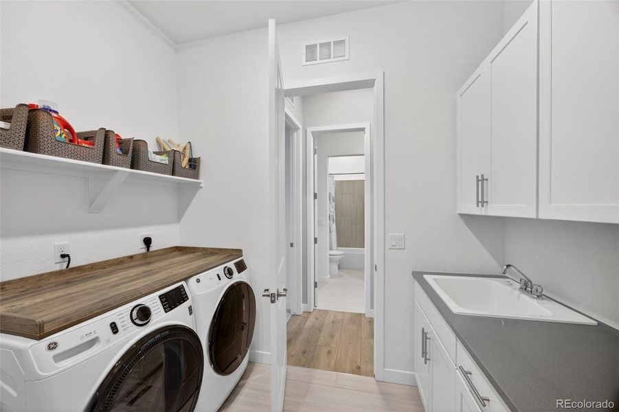 Laundry entrance from primary closet Laundry entrance from primary closet