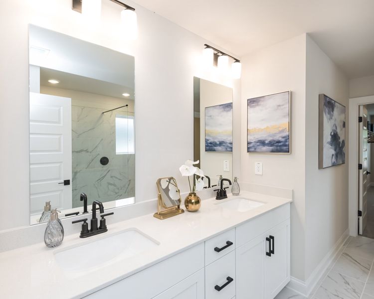 Getting ready in the morning is a breeze with the spacious dual-vanity countertop.
