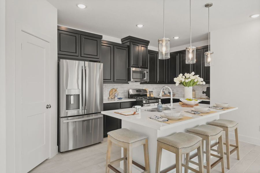 Representative furnished interior of a home built from the Chalet by Chesmar Homes in Meridiana Townhomes, Iowa Colony (Image 13).