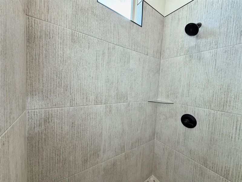Bathroom view of tiled shower