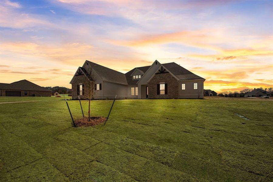 Front exterior of a new home in King Crossing Estates, Van Alstyne, TX, highlighting curb appeal (Image 19). Front exterior of a new home in King Crossing Estates, Van Alstyne, TX, highlighting curb appeal (Image 19).