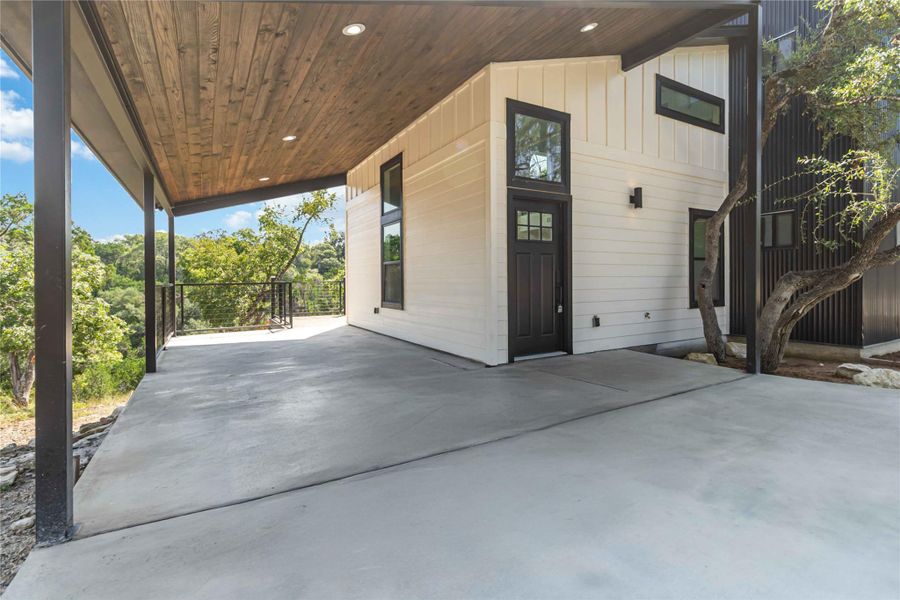 Attached carport area featuring a tongue-and-groove ceiling with recessed lighting for a polished, upscale look. Attached carport area featuring a tongue-and-groove ceiling with recessed lighting for a polished, upscale look.