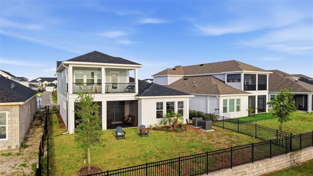 Front exterior of a new home in Emerald Landing at Waterside at Lakewood Ranch – Lake Series, Sarasota, FL, highlighting curb appeal (Image 26). Front exterior of a new home in Emerald Landing at Waterside at Lakewood Ranch – Lake Series, Sarasota, FL, highlighting curb appeal (Image 26).
