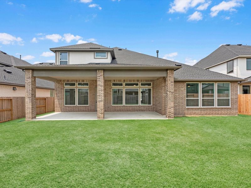 Front exterior of a new home in Cross Creek Ranch 65′, Fulshear, TX, highlighting curb appeal (Image 19). Front exterior of a new home in Cross Creek Ranch 65′, Fulshear, TX, highlighting curb appeal (Image 19).