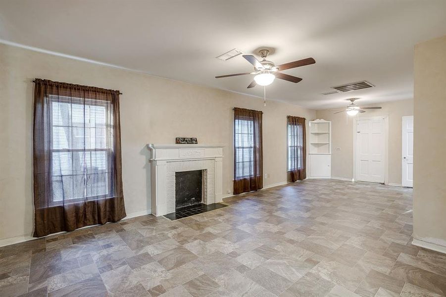Decorative fireplace and built ins in the downstairs primary bedroom. Decorative fireplace and built ins in the downstairs primary bedroom.