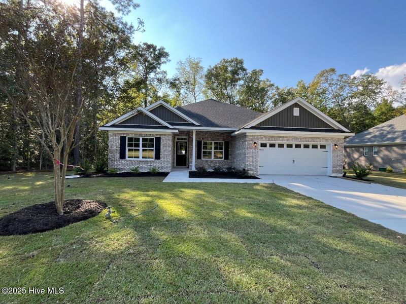 Front exterior of a new home in Palmetto Creek, Bolivia, NC, highlighting curb appeal (Image 2). Front exterior of a new home in Palmetto Creek, Bolivia, NC, highlighting curb appeal (Image 2).