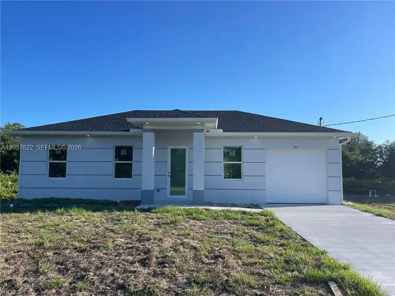 Front exterior of a new home in , Lehigh Acres, FL, highlighting curb appeal (Image 1). Front exterior of a new home in , Lehigh Acres, FL, highlighting curb appeal (Image 1).