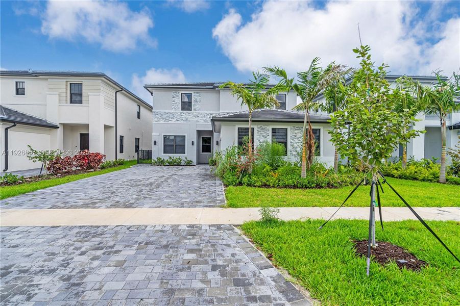 Front exterior of a new home in , Miramar, FL, highlighting curb appeal (Image 1).