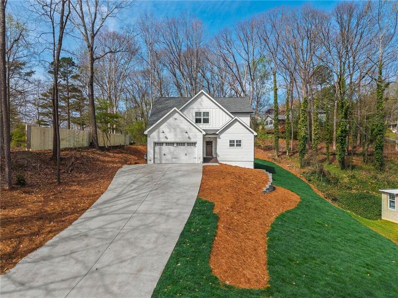 Front exterior of a new home in , Woodstock, GA, highlighting curb appeal (Image 22).