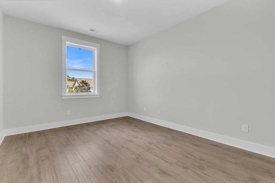 Spacious, unfurnished interior of a new home in Hidden Ponds Reserve, Awendaw (Image 15).