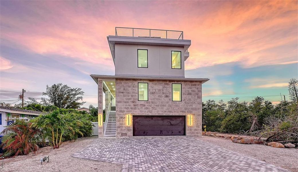 Front exterior of a new home in , Holmes Beach, FL, highlighting curb appeal (Image 2). Front exterior of a new home in , Holmes Beach, FL, highlighting curb appeal (Image 2).