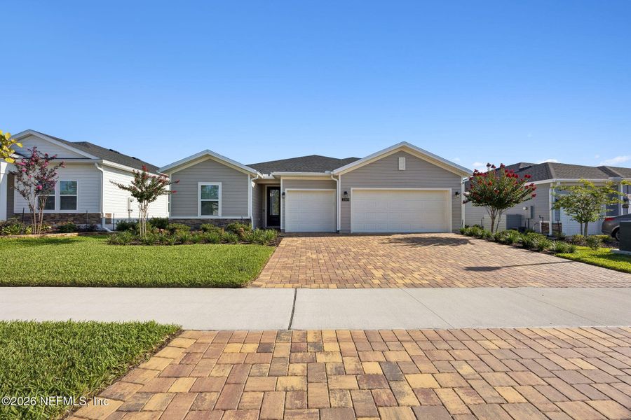 Front exterior of a new home in Edenbrooke at Hyland Trail | 55+, Green Cove Springs, FL, highlighting curb appeal (Image 25). Front exterior of a new home in Edenbrooke at Hyland Trail | 55+, Green Cove Springs, FL, highlighting curb appeal (Image 25).