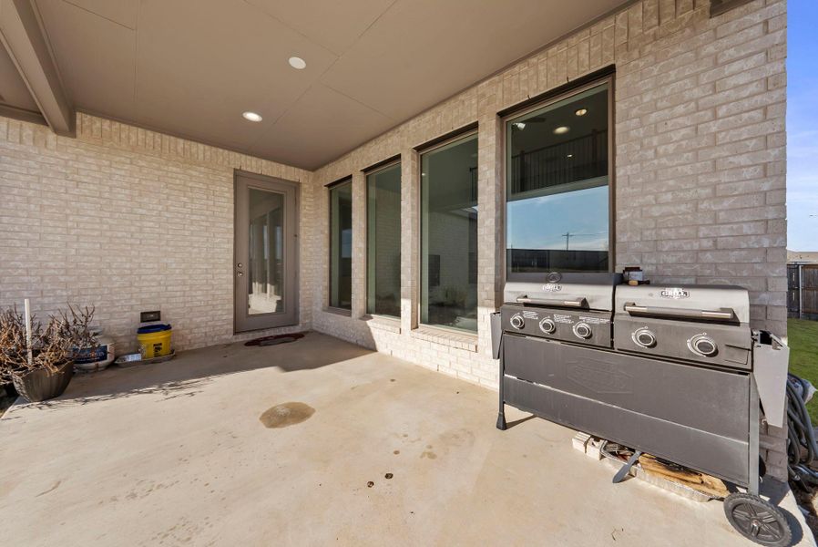 View of patio featuring area for grilling