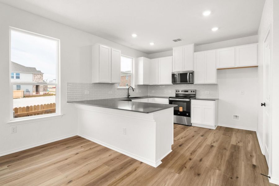 Furnished interior view inside a new home in Creekside at Estancia, Austin (Image 6).