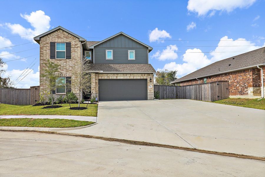 Front exterior of a new home in Heights of Barbers Hill, Baytown, TX, highlighting curb appeal (Image 1).