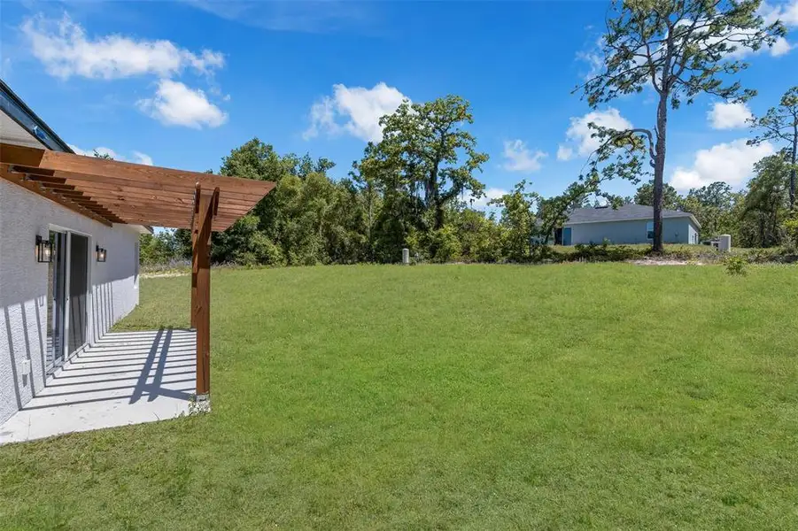Exterior details and patio area of a home in , Ocala (Image 31).