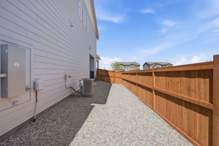 Exterior details and patio area of a home in Sky Ranch, Watkins (Image 23).