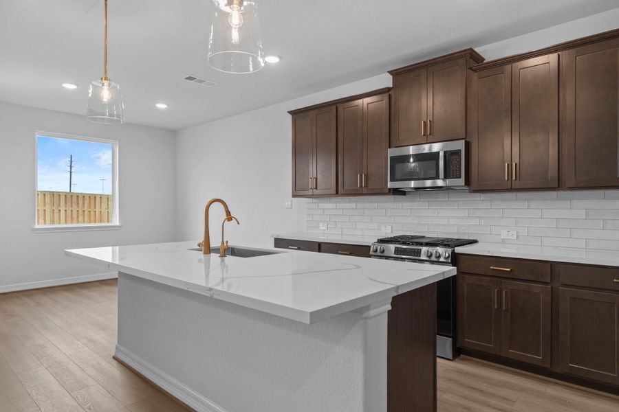 Kitchen. Sample product photo. Actual exterior and interior selections may vary by homesite. Photo may be virtually staged. Kitchen. Sample product photo. Actual exterior and interior selections may vary by homesite. Photo may be virtually staged.