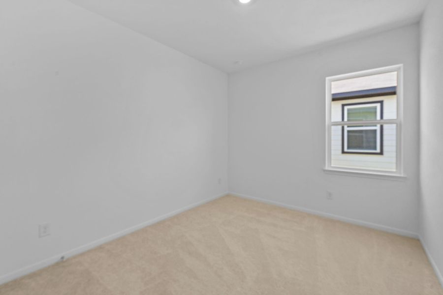 The front bedroom is currently vacant and ready for its newest home owner!
