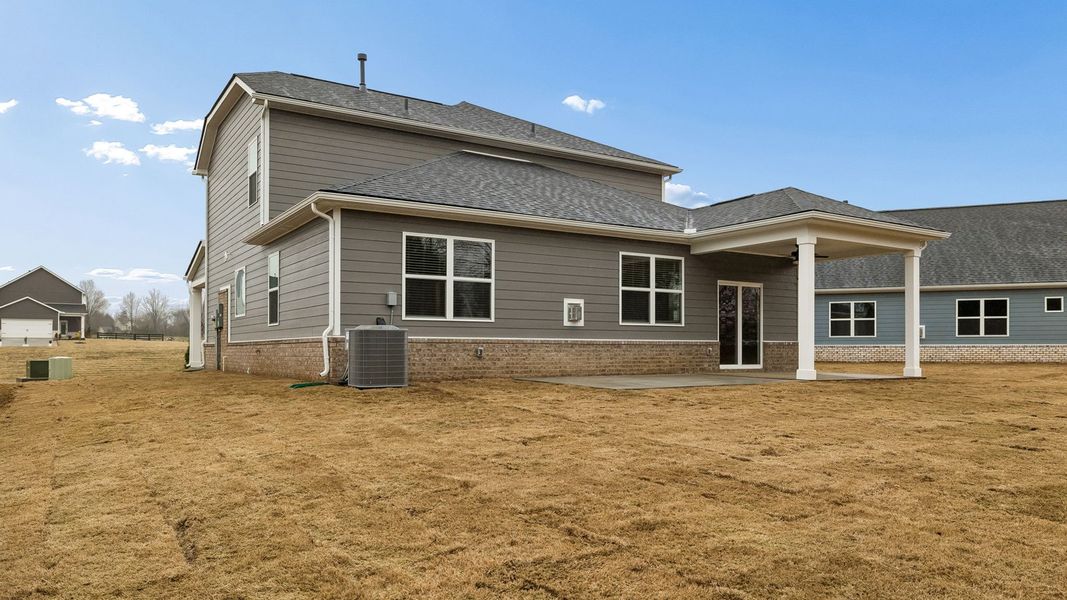 Exterior details and patio area of a home in Harvest Point, Spring Hill (Image 29).
