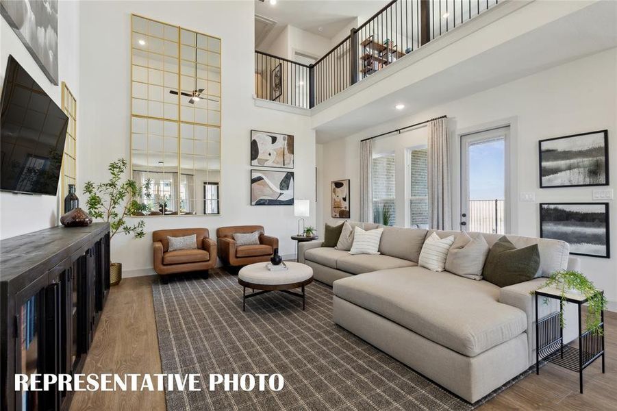 You'll find high ceilings, open railings and walls of windows in our family rooms in Hazelwood!  REPRESENTATIVE PHOTO OF MODEL HOME