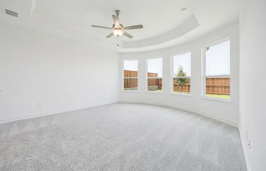 Owner's suite featuring a Picturesque Bay Window *Real home pictured Owner's suite featuring a Picturesque Bay Window *Real home pictured