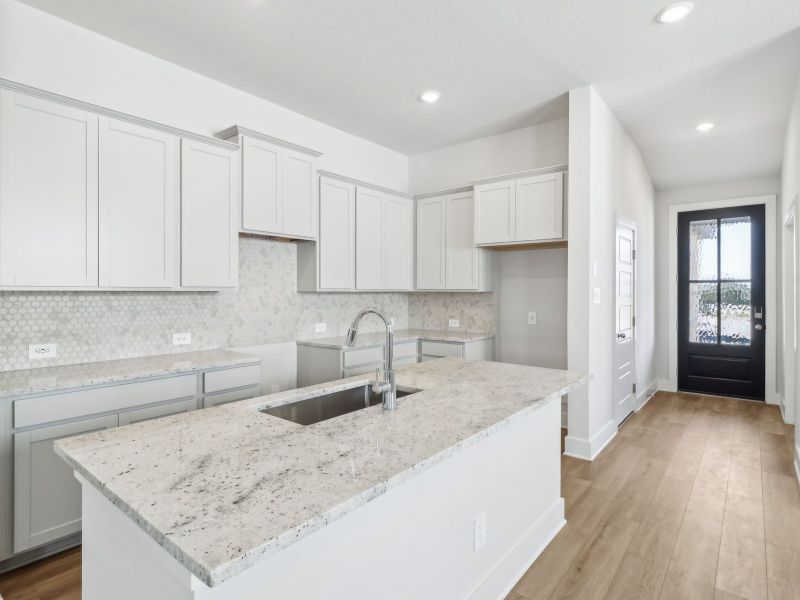 Kitchen in the San Saba floorplan at a Meritage Homes community.