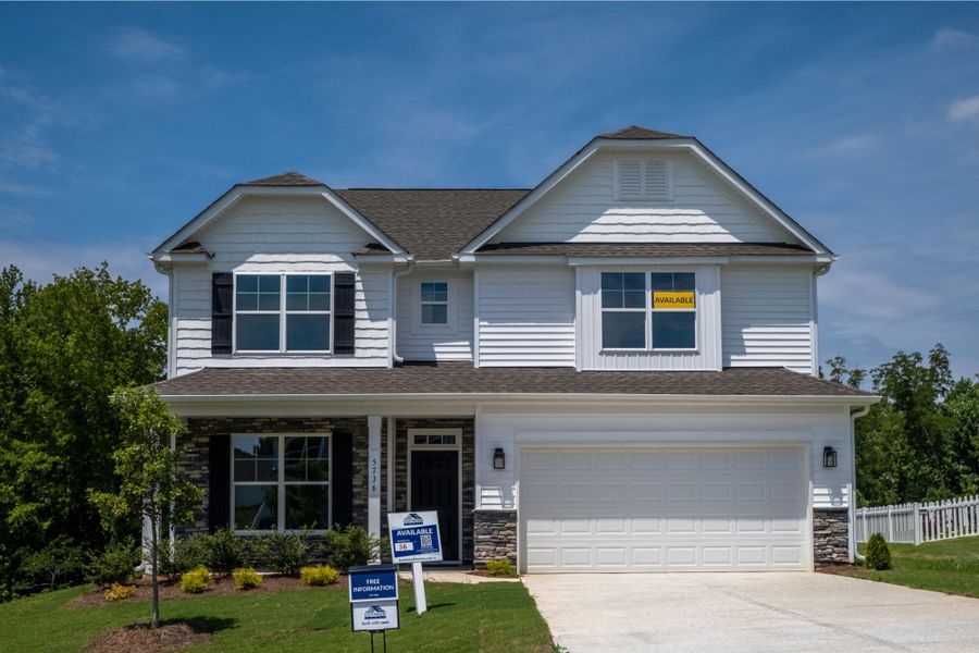 Front exterior of a new home in Cottages at Piper Village, Trinity, NC, highlighting curb appeal (Image 1). Front exterior of a new home in Cottages at Piper Village, Trinity, NC, highlighting curb appeal (Image 1).