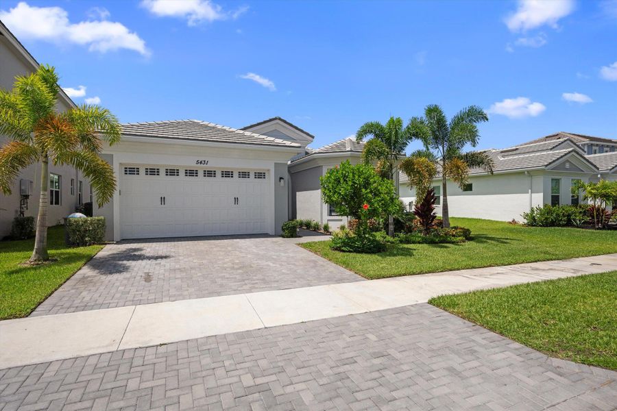 Front exterior of a new home in , Westlake, FL, highlighting curb appeal (Image 29).