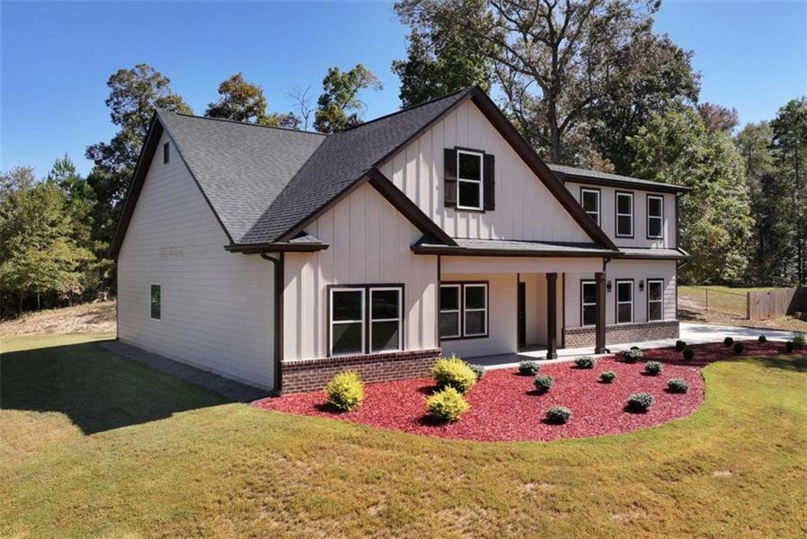 Front exterior of a new home in , Jefferson, GA, highlighting curb appeal (Image 1).