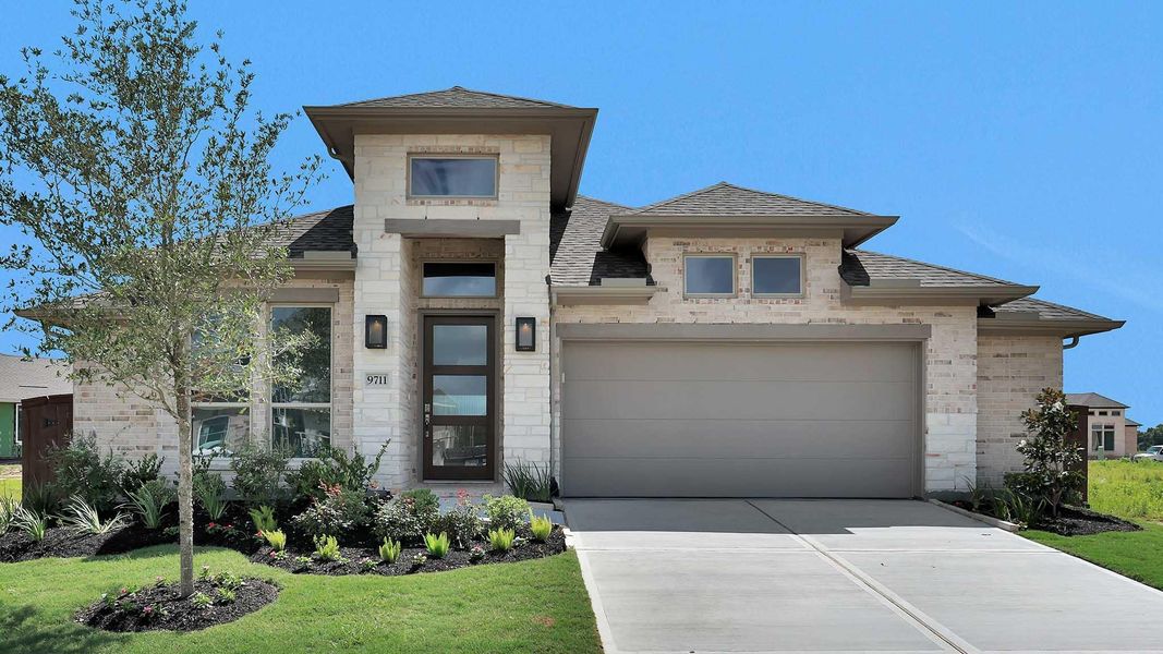 Front exterior of a new home in Meridiana, Manvel, TX, highlighting curb appeal (Image 2). Front exterior of a new home in Meridiana, Manvel, TX, highlighting curb appeal (Image 2).